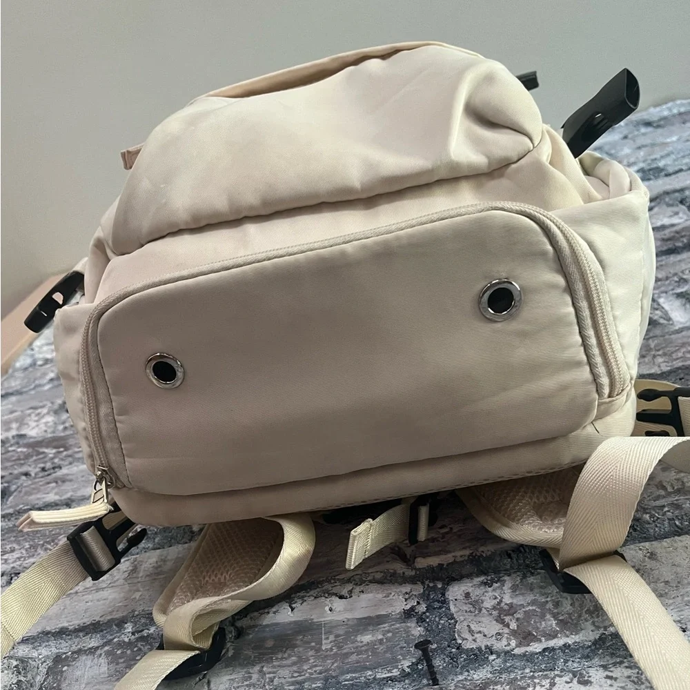 Elegant offwhite Travel carry on Backpack.So many compartments, zippers allwork🌸